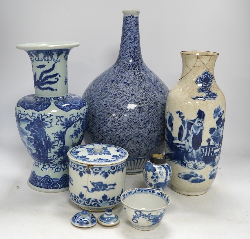 Four Chinese blue and white vases, a jar and cover and a tea bowl, Kangxi to 20th century, tallest vase 38cm high. Condition - poor